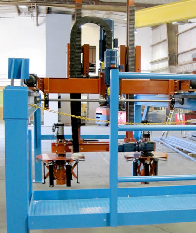 Gantry Transfer with dual pick-and-rotate heads for green tire transfer.